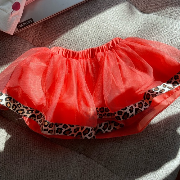 2 x skirts one is Disney baby (the one with leopard print on the trim) - Picture 1 of 3